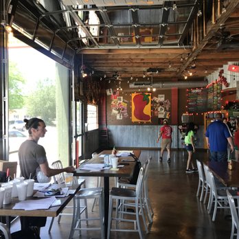Taco Mama - Florence - View of the Entry area with large garage door raised - Mexican Near Me - Florence, Alabama Taco Mama - Florence - View of the Entry area with large garage door raised - Mexican Near Me - Florence, Alabama
