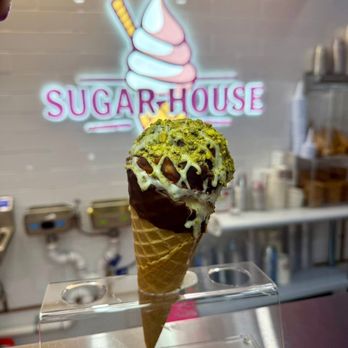 Sugar House Ice Cream - Jumbo waffles cone with 2 scoops dipped in hard chocolate coating with white chocolate drizzle , topped off with crushed pistachios. - Waffles Near Me - Staten Island, New York Sugar House Ice Cream - Jumbo waffles cone with 2 scoops dipped in hard chocolate coating with white chocolate drizzle , topped off with crushed pistachios. - Waffles Near Me - Staten Island, New York