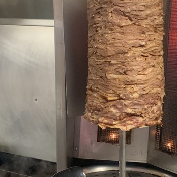 Pita Giovani - a skewer of meat being cooked - Food Trucks Near Me - Portland, Oregon Pita Giovani - a skewer of meat being cooked - Food Trucks Near Me - Portland, Oregon