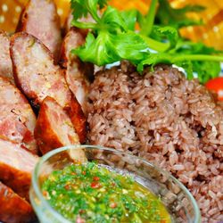 Thaj Yeeb Kitchen - Hmong Sausage with Purple Sweet Rice and a side of Hmong pepper sauce.