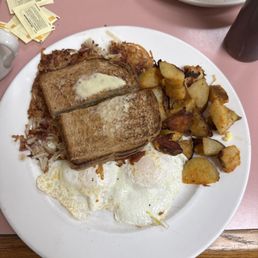 eggs, toast, and potatoes on a plate