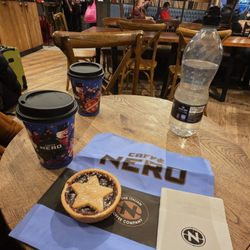 Caffè Nero - Caffe latte and bakery item