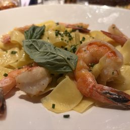 Shrimp with papperdelle pasta in butter sauce.