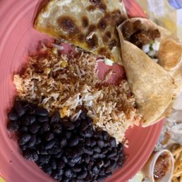 Ground beef, quesadilla, rice, and black beans.