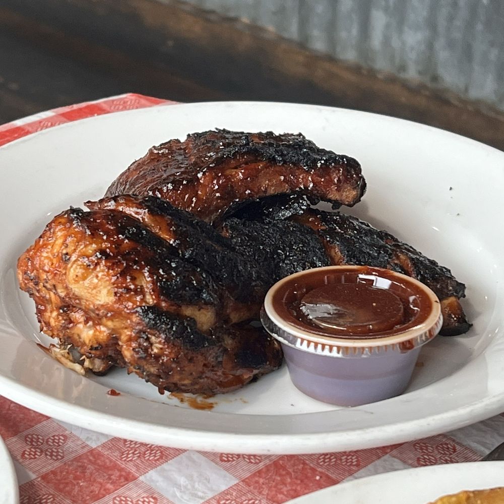 a plate of barbecued chicken