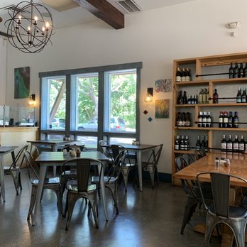 Arte Pizza - a dining area with tables and chairs - Pizza Near Me - Fernandina Beach, Florida