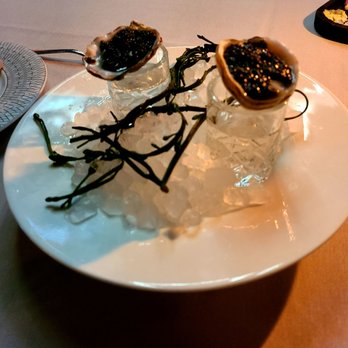 Maple & Ash - Oysters with caviar and a shot of vodka - Steakhouses Near Me - Chicago, Illinois
