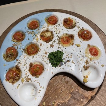 Libertango Steakhouse - The fired garlic went amazingly with the tomatoes and mozzarella. - Steakhouses Near Me - Sandy, Utah
