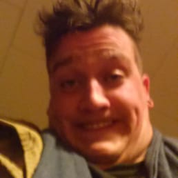 a man with a smile on his face a man with a smile on his face