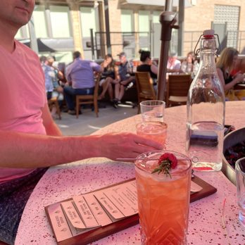 Ochos Cocktail & Wine Bar - a man sitting at a table - Wine Bars Near Me - Boise, Idaho Ochos Cocktail & Wine Bar - a man sitting at a table - Wine Bars Near Me - Boise, Idaho