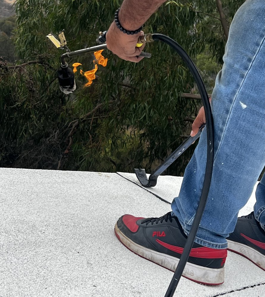 Slide of Kayhan's Roofing