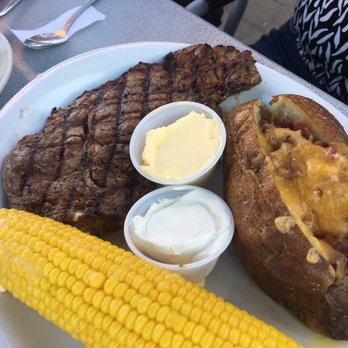 Cafe 22 West - Rib eye perfectly cooked with sweet corn n a loaded tuber - Diners Near Me - Salem, Oregon