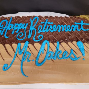 Cococakes By Coco - a cake with chocolate icing and blue icing - Bakeries Near Me - Tucker, Georgia Cococakes By Coco - a cake with chocolate icing and blue icing - Bakeries Near Me - Tucker, Georgia