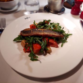 Peploe's Wine Bistro - Seared sea bass with assorted tomatoes, bread cube, and dandilion greens - Brasseries Near Me - Dublin, D Peploe's Wine Bistro - Seared sea bass with assorted tomatoes, bread cube, and dandilion greens - Brasseries Near Me - Dublin, D