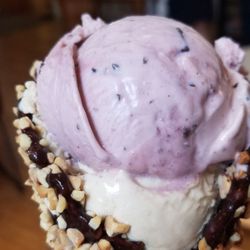 Cayuga Lake Creamery at The Dewitt Mall - Seneca Salt Caramel and Cherry Jubilee ice cream in a fancy waffle cone