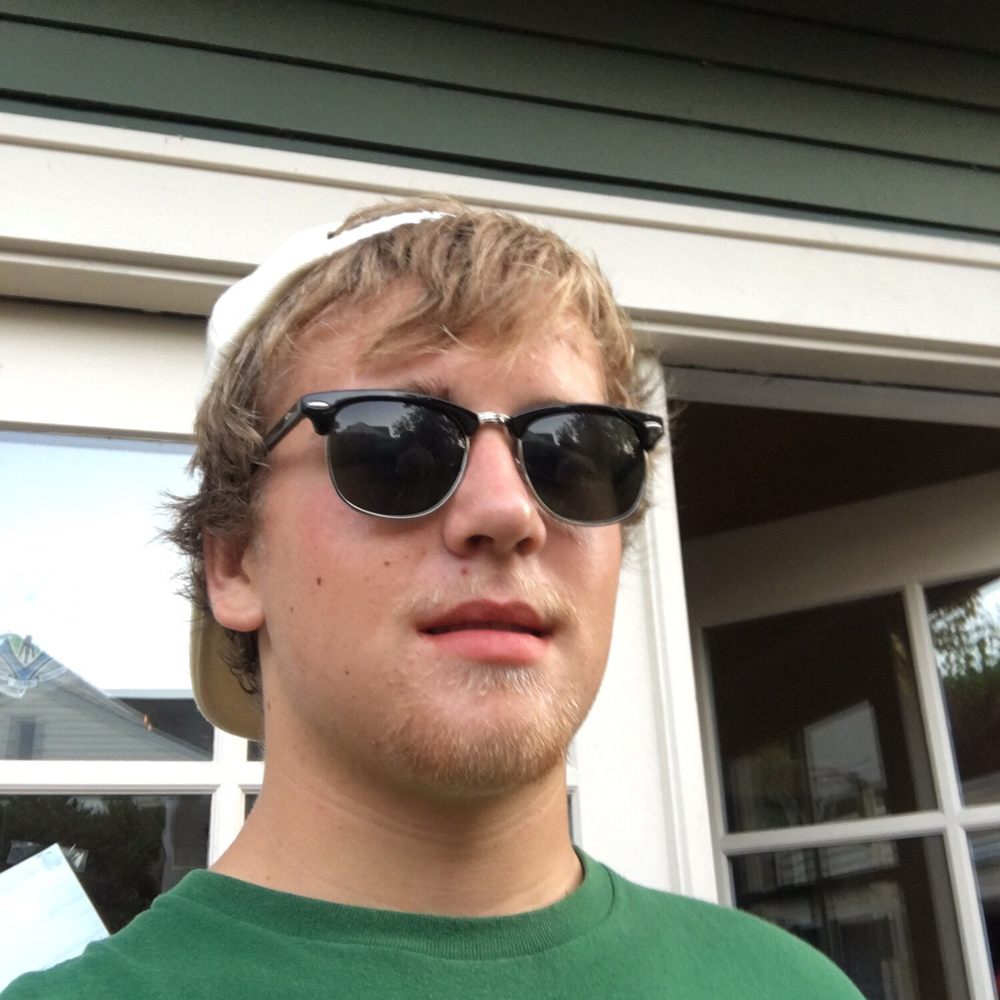 Taco Del Mar - a man wearing a green shirt and sunglasses - Mexican Near Me - Seattle, Washington Taco Del Mar - a man wearing a green shirt and sunglasses - Mexican Near Me - Seattle, Washington