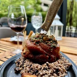 Ventanas Restaurant and Lounge - CHICHARRON PORK SHANK -  Rice & Beans, Sweet Plantains, Plum Sauce, Chimichurri