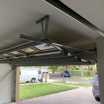 Garage Door and Spring Repair - Door off its traxkt - Garage Door Services Near Me