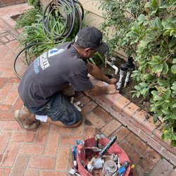Complete Plumbing And Rooter - Technician fixing sprinkle