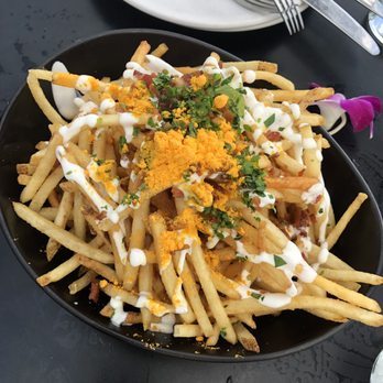 Offshore Rooftop - Their version of loaded fries. You either have to get them plain or everything on. - New American Near Me - Chicago, Illinois