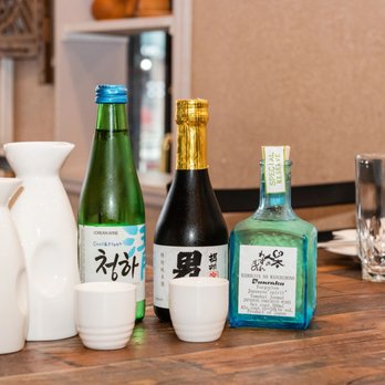 Yeomiji - a variety of sake bottles on a table - Korean Near Me - Scarsdale, New York Yeomiji - a variety of sake bottles on a table - Korean Near Me - Scarsdale, New York
