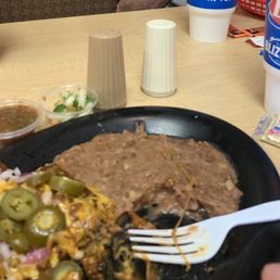Enchilada plate with refried beans. Enchilada plate with refried beans.