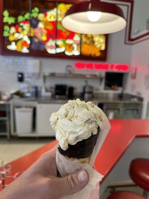 Photo of Bonnie Brae Ice Cream - Denver, CO, US. Cookie Dough ice cream in a chocolate dipped waffle cone.