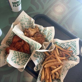 Wingstop - Original hot (bottom) & lemon pepper wings (top) & fries - Chicken Wings Near Me - Santa Ana, California Wingstop - Original hot (bottom) & lemon pepper wings (top) & fries - Chicken Wings Near Me - Santa Ana, California