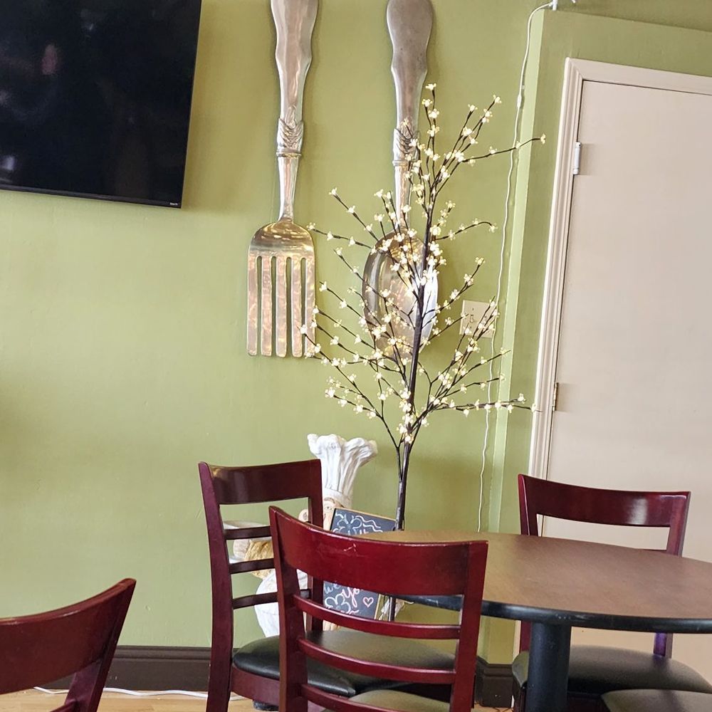 a table and chairs in a restaurant a table and chairs in a restaurant