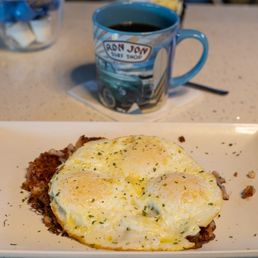 Corned Beef Hash and three eggs over medium. Corned Beef Hash and three eggs over medium.
