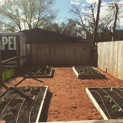Functional family garden in Northeast Austin. Granite pad keeps the weeds and mud down and the cedar lumber lasts decades.