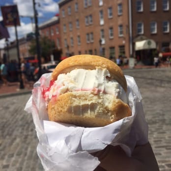Cream Cruiser - a person holding a sandwich in their hand - Ice Cream & Frozen Yogurt Near Me