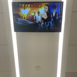 Trooth & Smiles - TVs in the Ceilings with Noise Cancelling Headphones. So you can watch Netflix during your appointment