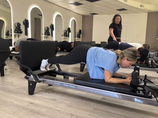 Semi-Private Reformer Pilates - Semi-Private Reformer Pilates
Embark on a transformative journey with our Semi-Private Reformer Pilates program at MVMTS. Designed to cater to participants at every fitness level, this dynamic session combines strength training, flexibility, and mindfulness. Whether you are a beginner looking to enhance core strength or a seasoned pro aiming to refine your technique, our expert instructors are dedicated to guiding you towards achieving your fitness goals.

Experience the Ultimate in Reform
Experience the unmatched synergy of strength and flexibility in a Semi-Private Reformer Pilates session at MVMTS. Unravel the hidden potential of your body as you engage in a series of precise movements, allowing for greater mobility and improved posture. Elevate your well-being by signing up today and embracing a journey towards enhanced physical health, mindfulness, and self-awareness.

Ignite Your Fitness Journey
Join us at MVMTS to embark on a fitness journey that transcends boundaries and unlocks your full potential. Embrace inclusivity, camaraderie, and personal growth as you delve into our Semi-Private Reformer Pilates program. Let MVMTS be your partner in achieving diverse fitness goals while fostering a sense of community. Take the first step towards holistic wellness and book your session now!
