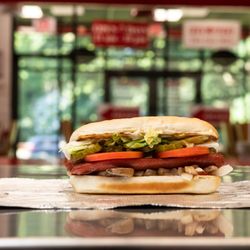 Five Guys - A Five Guys hot dog sits on the counter in a Five Guys restaurant.