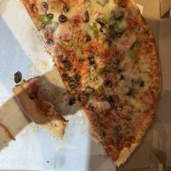 Red Tomato Pizzeria - Pizza slices left behind by numerous members of family.