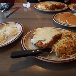 4Bs Restaurant - Chicken Fried Steak and Eggs with Pancakes 11.00 Fast Break Special in the back 6.25