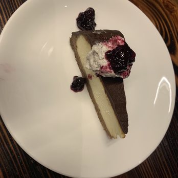Cypress Hall - Cheesecake with chocolate ganache, espresso cream and tart blueberry compote - New American Near Me - New Bern, North Carolina Cypress Hall - Cheesecake with chocolate ganache, espresso cream and tart blueberry compote - New American Near Me - New Bern, North Carolina