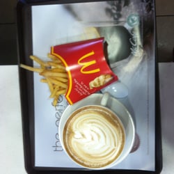 McDonald's - My cappuccino in a ceramic cup and fancy designer froth with fries.