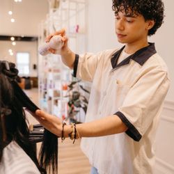 Verde Salon - Luis putting the perfect styling touches on his hair extension application.