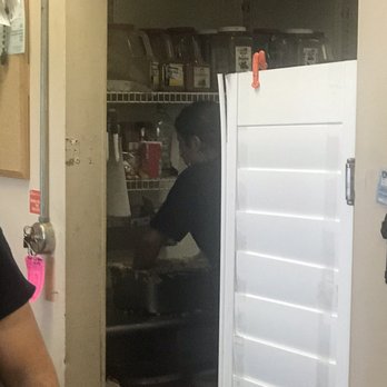 Mr Shrimp - Worker mixing up garlic butter with bare hands! No gloves or utensils used! - Seafood Near Me - Lake Worth, Florida Mr Shrimp - Worker mixing up garlic butter with bare hands! No gloves or utensils used! - Seafood Near Me - Lake Worth, Florida