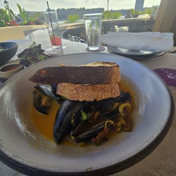 Maximón - Mussels chorizo, shallots, white wine, saffron, garlic, toast - Latin American Near Me - Baltimore, Maryland Maximón - Mussels chorizo, shallots, white wine, saffron, garlic, toast - Latin American Near Me - Baltimore, Maryland