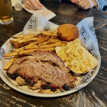 Sam Jones BBQ - Mixed meat plate with fries, sweet potato muffin and Mac & cheese. - Barbeque Near Me - Raleigh, North Carolina Sam Jones BBQ - Mixed meat plate with fries, sweet potato muffin and Mac & cheese. - Barbeque Near Me - Raleigh, North Carolina
