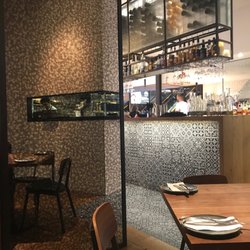 Assembly Bar - Antique mirrors & Black & White concrete tiles make for great ambiance !