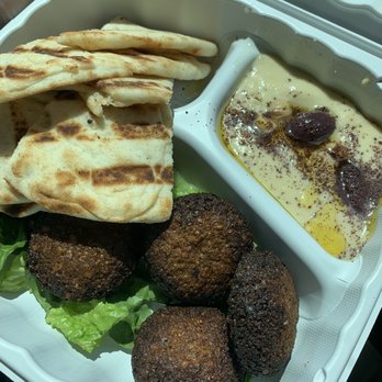 Olive On Main - Burnt falafel appetizer with falafel carefully placed with the lesser burnt side facing up. - Mediterranean Near Me - Laurel, Maryland Olive On Main - Burnt falafel appetizer with falafel carefully placed with the lesser burnt side facing up. - Mediterranean Near Me - Laurel, Maryland