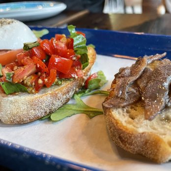 Menomale NoMa - a plate of sandwiches with meat and vegetables - Pizza Near Me - Washington, DC, District of Columbia