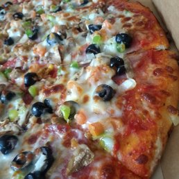 a pizza with olives and cheese