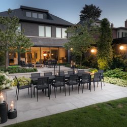 The Great Escape - Backyard patio featuring a spacious outdoor table and cozy lounge seating