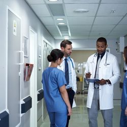 Monmouth Medical Center Southern Campus - Group of physicians reviewing a chart.