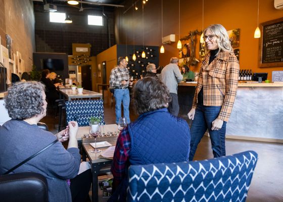 Photo of Gard Vintners Wine Tasting Room - Woodinville, WA, US. a woman in a plaid shirt